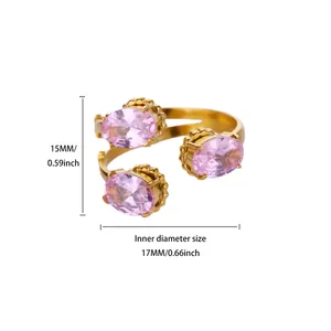 Detailed view of gold plated ring with pink zircon heart and size measurements