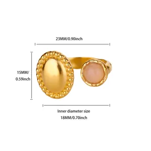 Detail view of adjustable gold ring with pink zircon and oval beaded metal plate