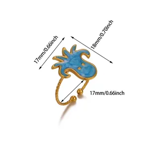 Detail view of octopus ring in blue enamel with gold finish and adjustable 17mm band size
