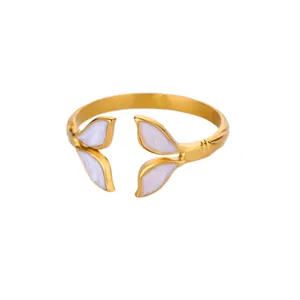 Adjustable golden stainless steel ring featuring elegant white enamel leaf ornaments