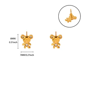 Close-up of gold bear stud earrings with crystal inlay and size measurement details