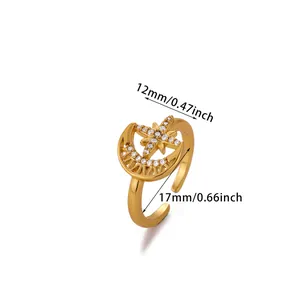 Detailed view of adjustable gold star and moon ring with measurements in mm and inches