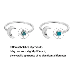 Detailed view of crescent moon and eight-pointed star rings with blue stone inlay