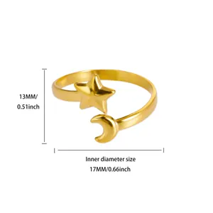 Detail view of gold star and moon ring showing 17mm inner diameter and 13mm ornament height