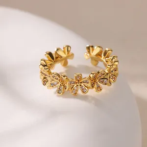 Elegant gold flower ring with zircon petals in a luxury minimalist adjustable open design