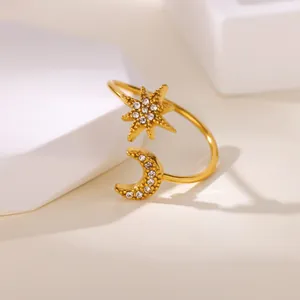 Elegant gold celestial open ring featuring diamond-studded crescent moon and star design