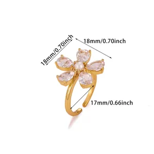 Detailed view of adjustable golden flower ring with zircon petals and pearl center