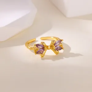 18K gold plated open ring featuring a purple zircon bow with marquise cut stones