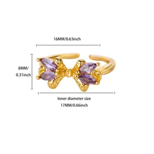 Detailed macro view of 18K gold plated bow ring with purple marquise zircon stones