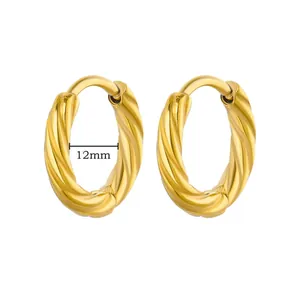Detail of 18K gold plated huggie earrings with spiral texture and 12mm inner diameter