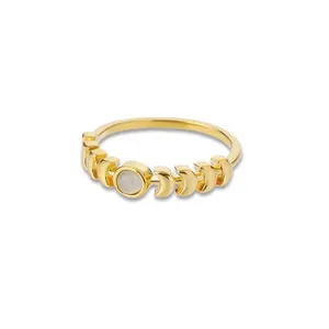 Detailed macro view of gold plated ring with moonstone inlay and lunar phase carvings