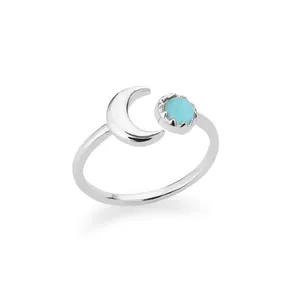 Detail shot of moon-shaped open ring with turquoise stone in silver finish
