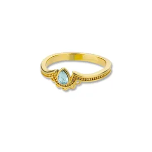 Detailed view of pear-shaped moonstone set in a gold-plated vintage style ring