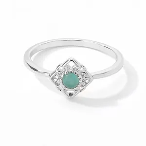 Detailed view of turquoise gemstone ring with intricate geometric silver hollow pattern