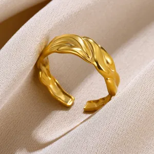 Macro shot of gold-plated open ring with modern irregular lava texture details