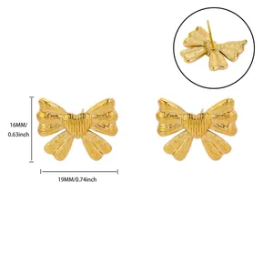 Detail showing 18K gold plated bow earrings with size dimensions 16mm by 19mm