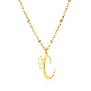Detailed macro view of golden stainless steel letter C pendant with butterfly accent