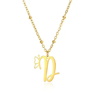 Detailed close-up of gold butterfly initial D pendant with elegant ball chain necklace