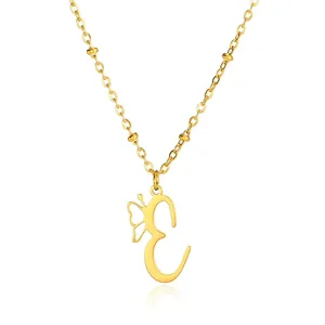 Detail of gold stainless steel necklace featuring a letter E pendant with a butterfly charm