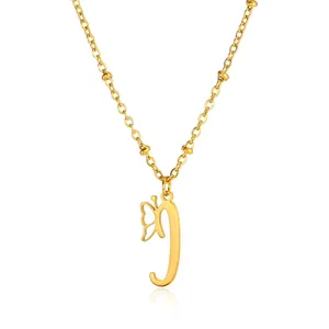 Detail of golden butterfly and letter J pendant on a beaded stainless steel chain