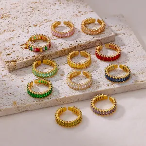 Macro shot of 11pcs vintage gold plated rings with colorful rectangular cubic zirconia