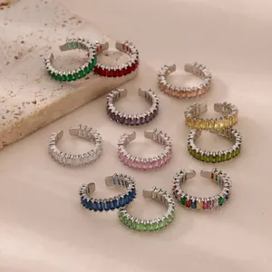 Macro shot of assorted colorful rectangular cut zircon ear cuffs with silver plating