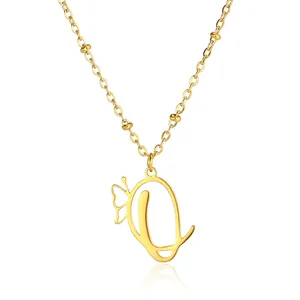 Detailed close-up of golden stainless steel chain with a butterfly and letter Q pendant