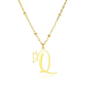 Close-up of golden stainless steel butterfly initial Q pendant necklace with beaded chain