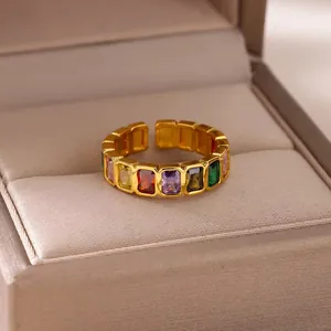 Rainbow cubic zirconia 18K gold plated open ring on a beige velvet jewelry box