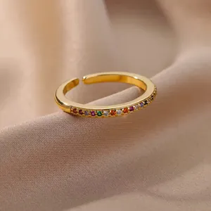 18K gold plated adjustable ring featuring vibrant rainbow zircon stones on satin fabric