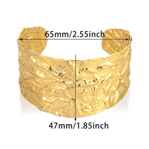 Detail showing dimensions of 65mm wide gold textured cuff with irregular hammered finish