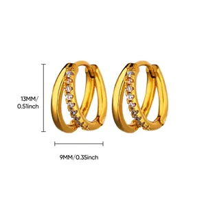 Detail of gold huggie earrings with cubic zirconia inlay and 13mm height dimensions