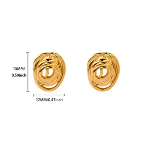 Detail view of gold spiral knot stud earrings measuring 15mm with polished finish