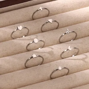 Minimalist stainless steel ring set with sun moon star symbols in a velvet display box