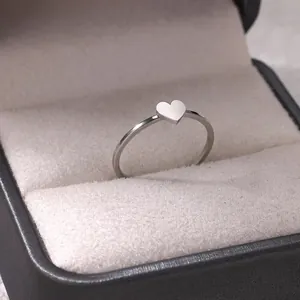 Minimalist silver heart ring presented in a premium black leather jewelry gift box