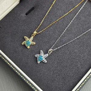 Starfish shell necklaces in gold and silver finish with blue rhinestones and shell center