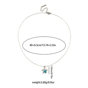Detail showing dimensions and weight of starfish pendant with blue shell element