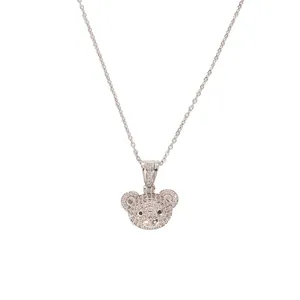 Macro shot of bear pendant featuring sparkling zircon pavé and detailed silver chain