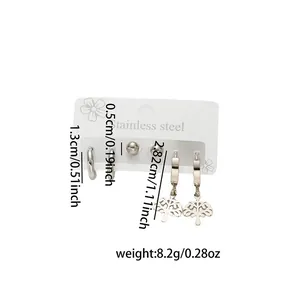 Three-pair silver stainless steel earring set featuring studs, hoops, and tree pendants