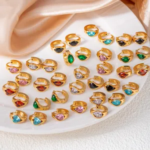 Elegant gold hoop earrings with colorful heart and marquise zircon stones on silk