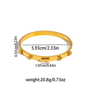 Golden open bangle with rose flower and bowknot charms, diameter size measurements