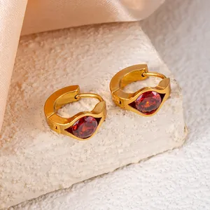 Gold titanium steel hoop earrings with deep red zircon stones in geometric settings