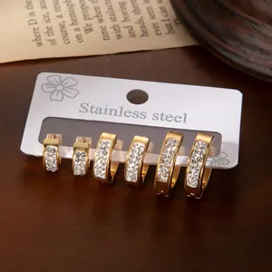 Three pairs of gold-plated stainless steel hoop earrings with double-row cubic zirconia
