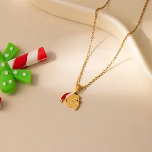 Collier en acier doré avec pendentif Père Noël festif aux détails rouge et blanc