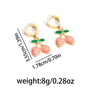Elegant gold cherry drop earrings with pink marble texture and green leaf accents