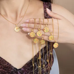 Gold stainless steel zodiac coin necklace with colorful star-shaped cubic zirconia stones