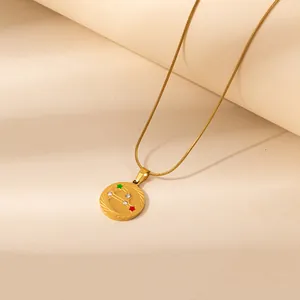 Elegant gold constellation necklace featuring round celestial pendant and snake chain