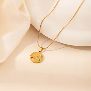 Gold stainless steel zodiac necklace featuring a constellation disc pendant on a snake chain