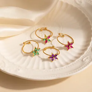Close-up of golden adjustable floral rings with marquise-cut zircon in various colors