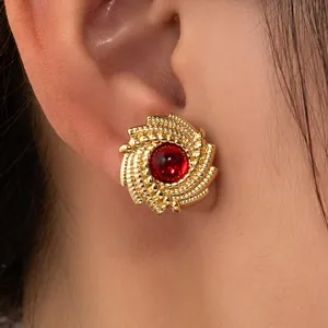 Vintage gold spiral round stud earrings featuring a red stone inlay for women